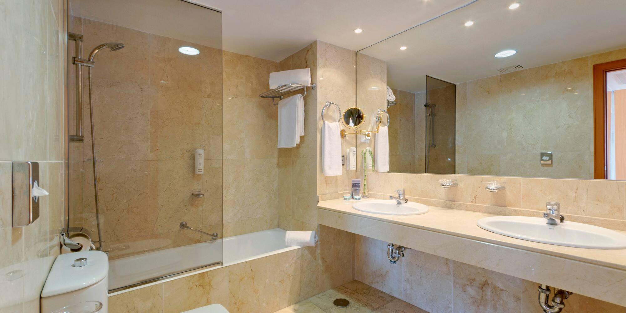 a bathroom with a shower and sink