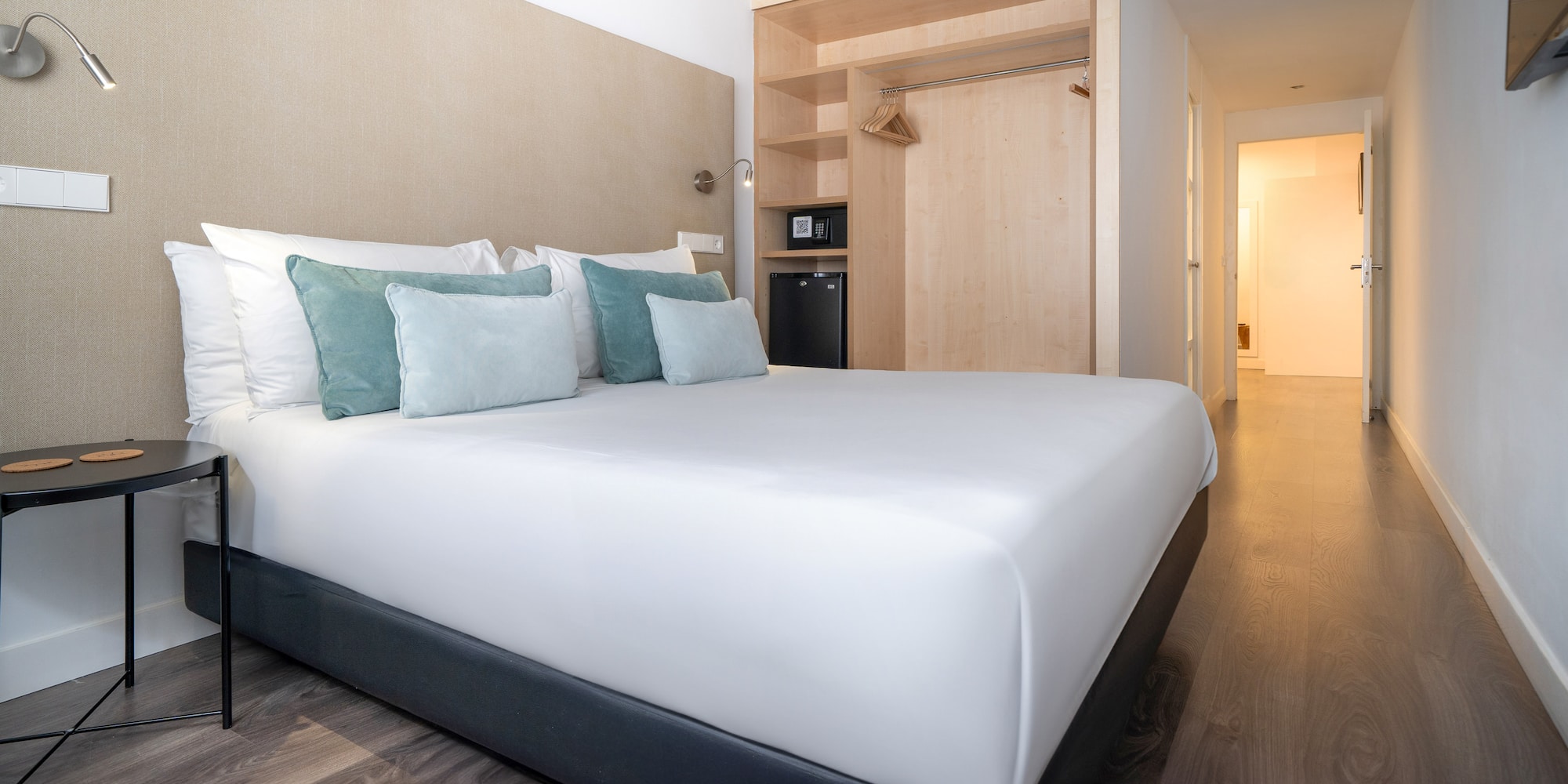 a bed with pillows in a room