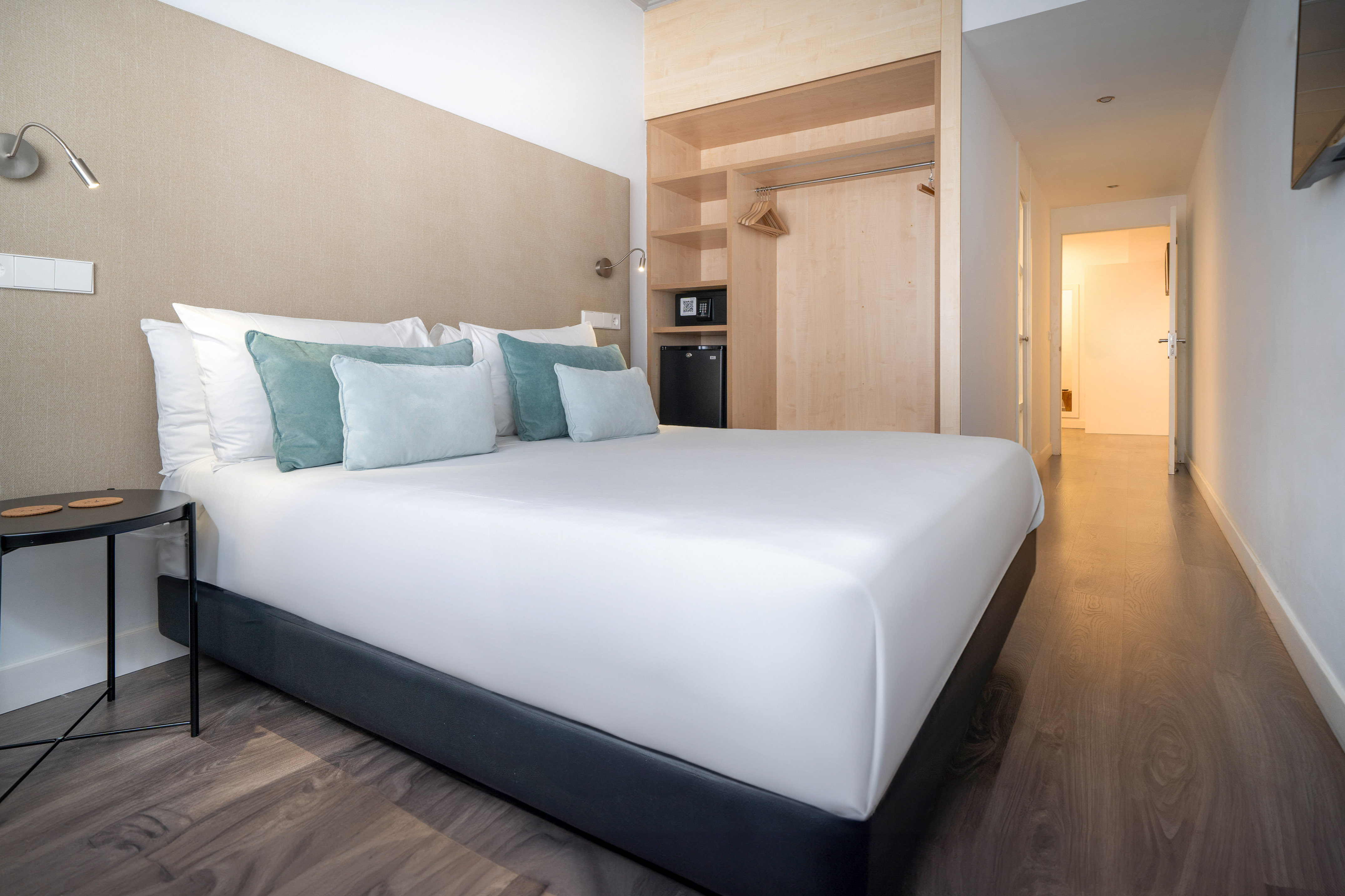 a bed with pillows in a room