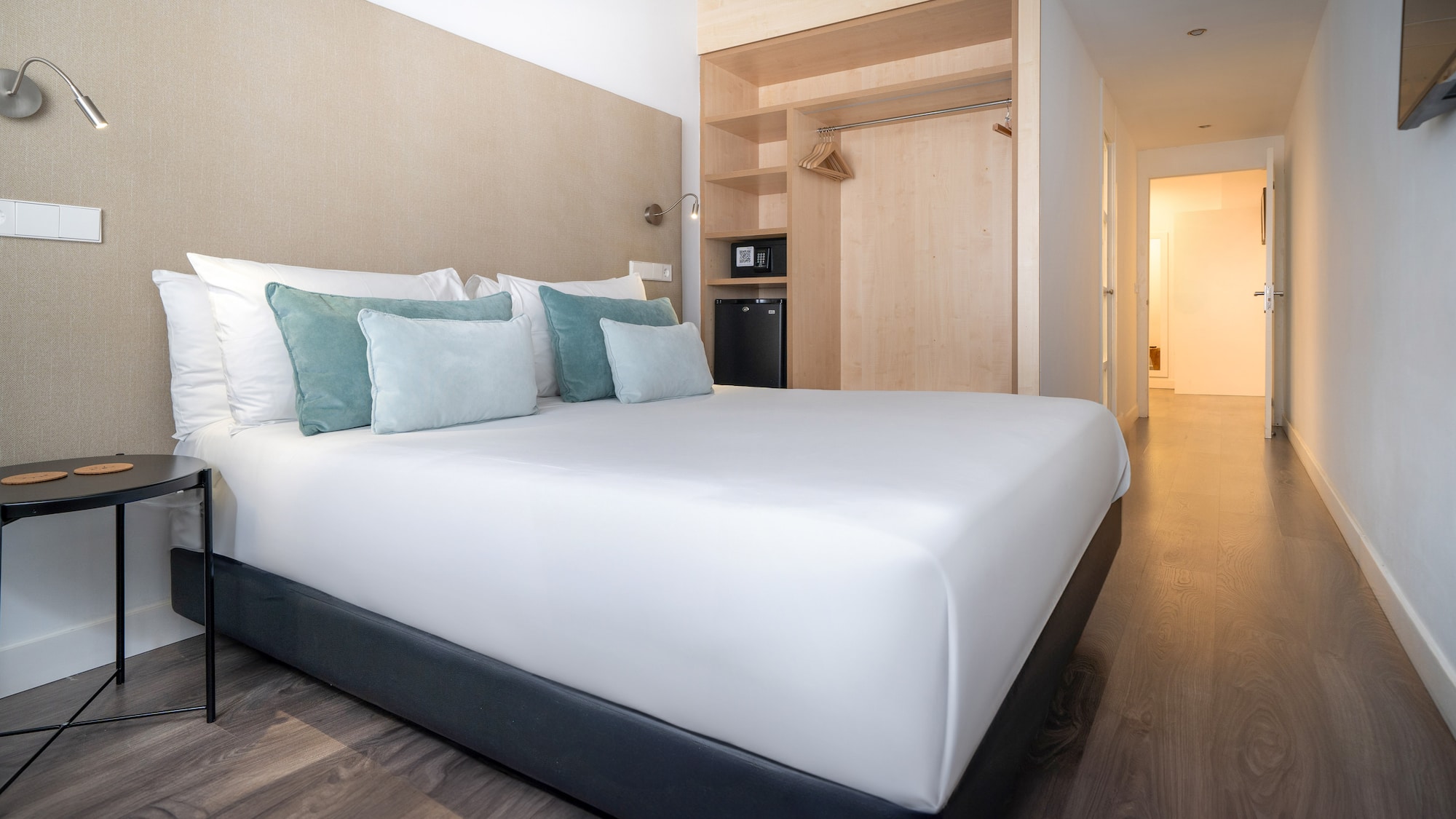 a bed with pillows in a room