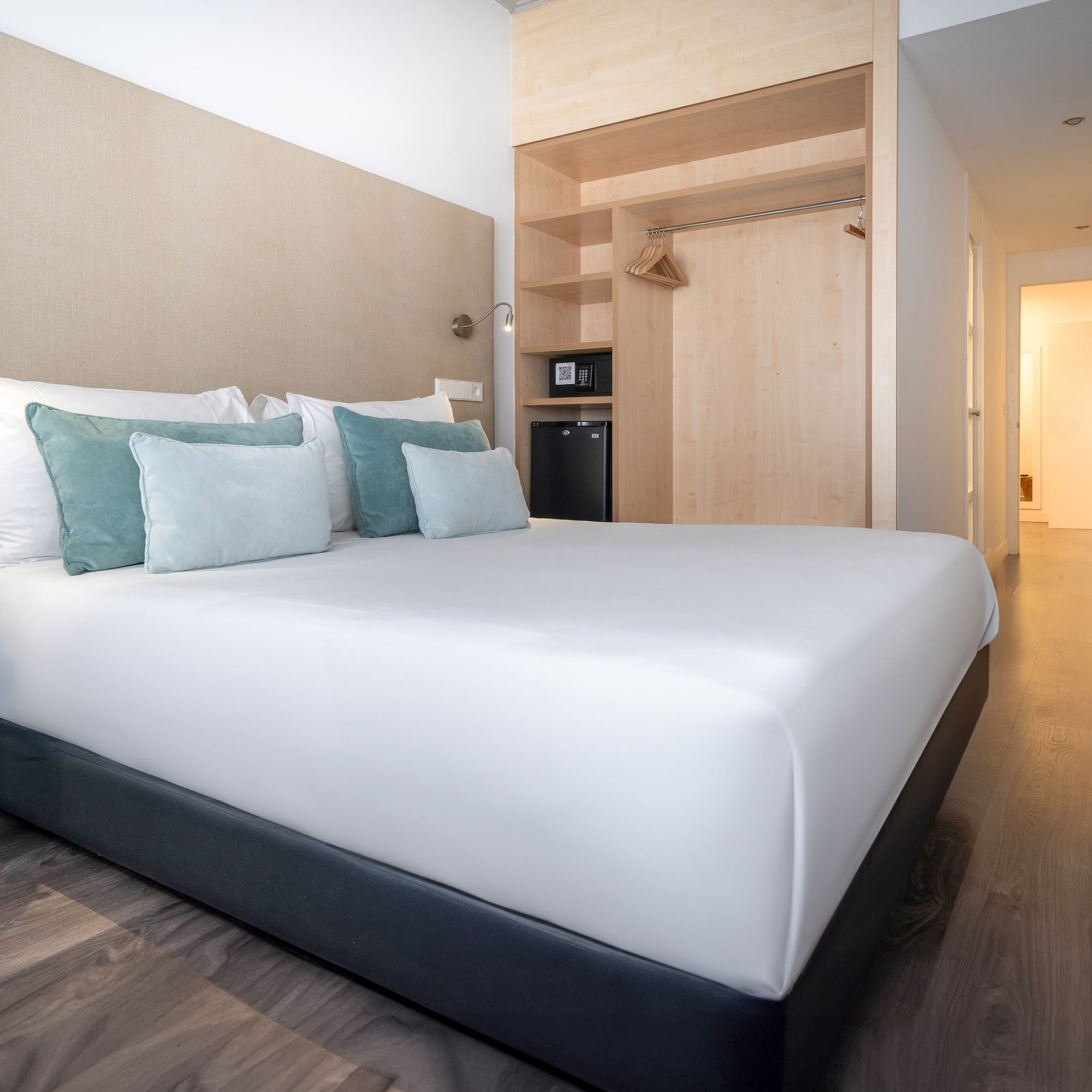 a bed with pillows in a room