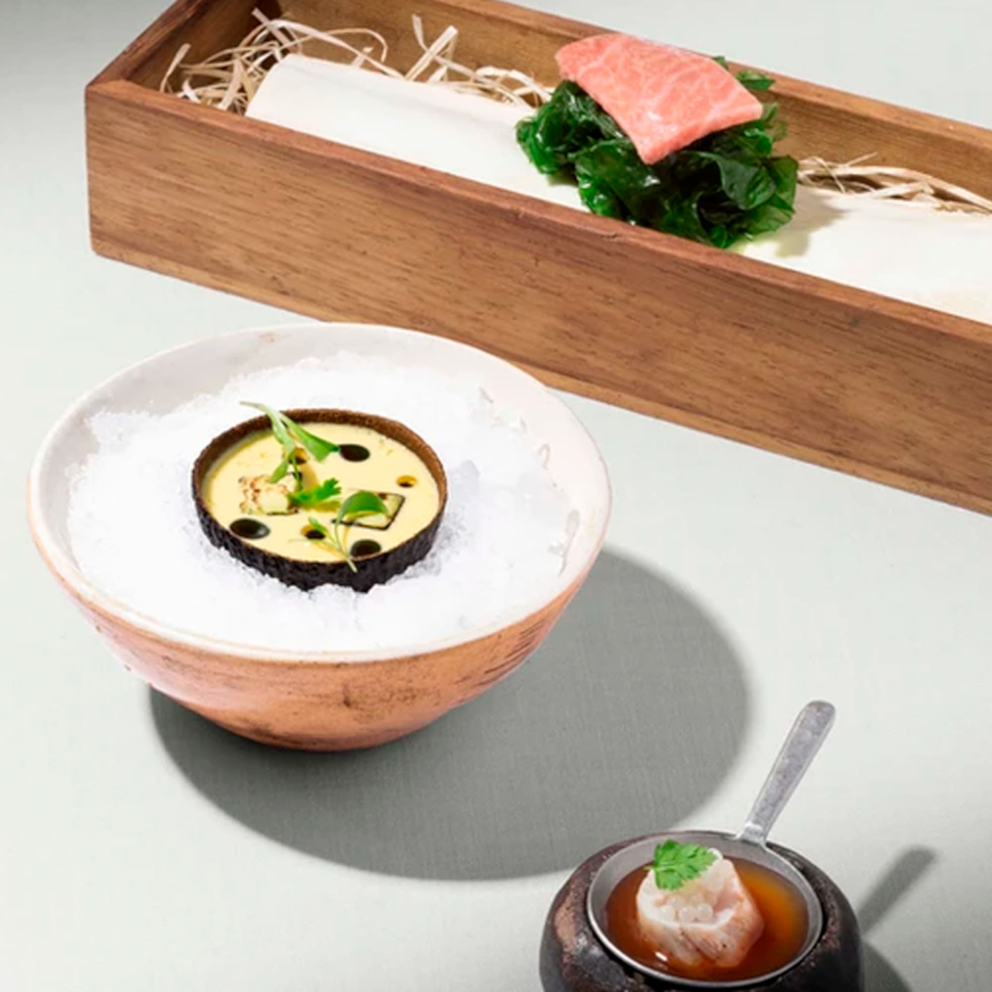 a bowl of food in a wooden box