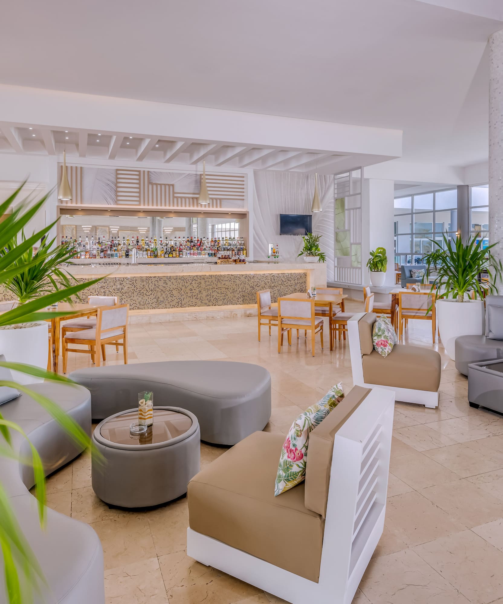 a room with a large counter and chairs