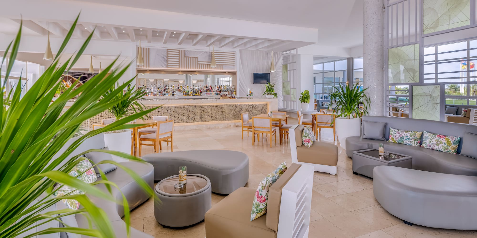 a room with a large counter and chairs