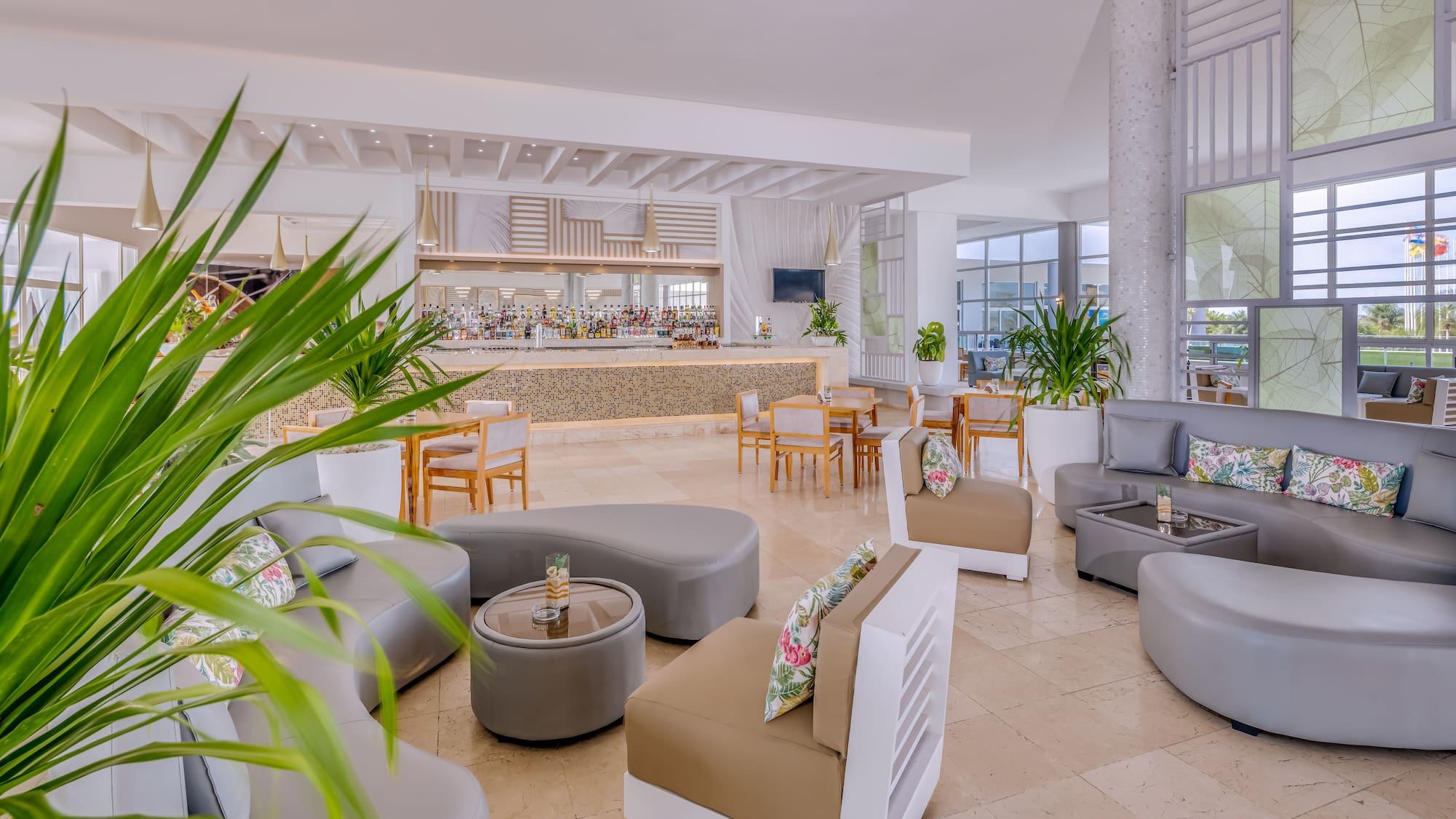 a room with a large counter and chairs