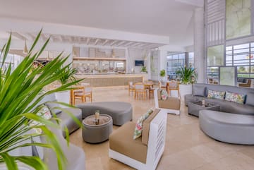 a room with a large counter and chairs