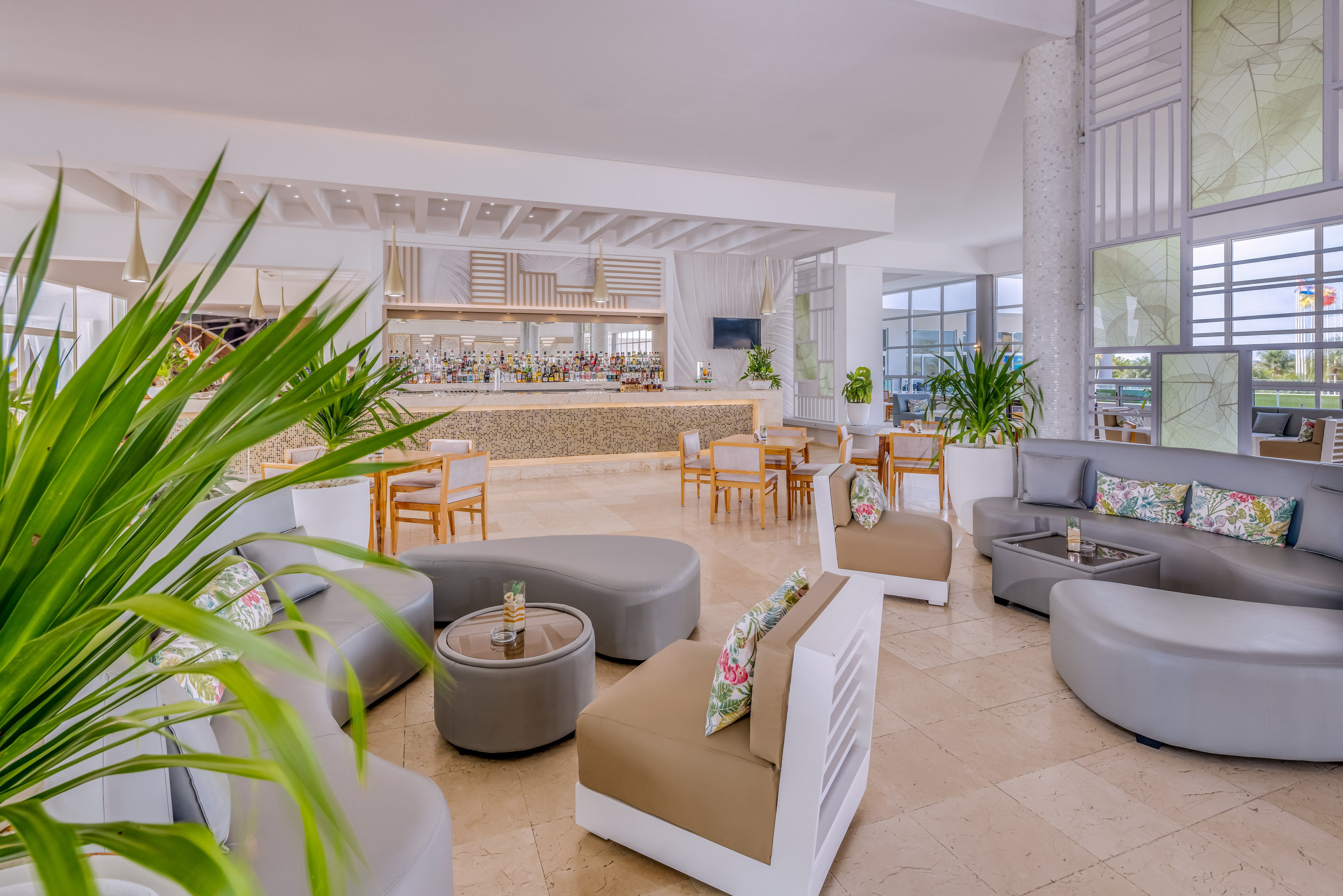 a room with a large counter and chairs