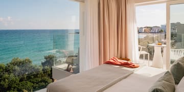 a bed with a view of the ocean