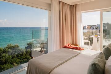a bed with a view of the ocean