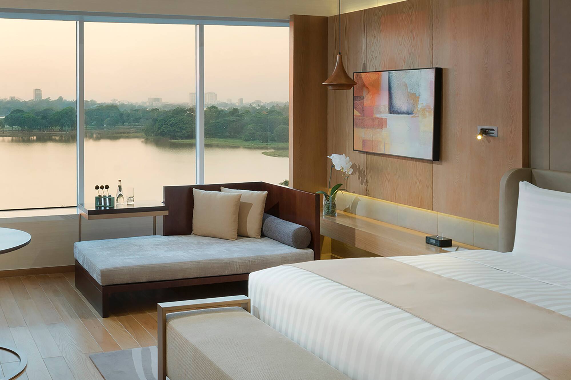 a room with a bed and couches