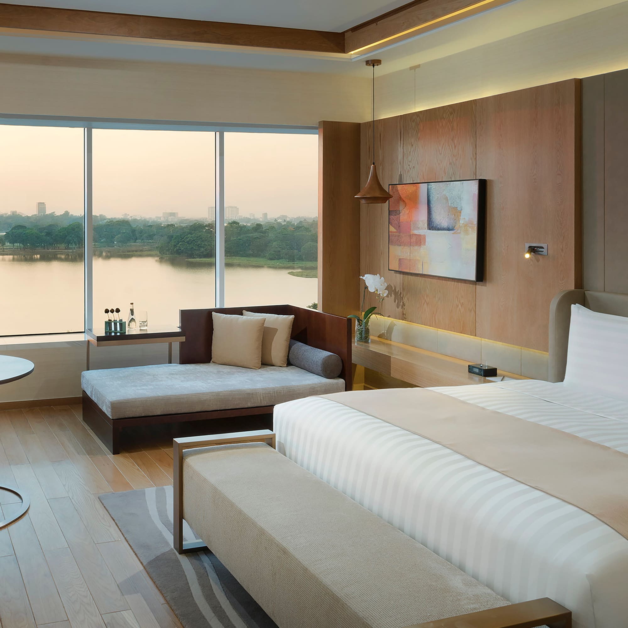 a room with a bed and couches