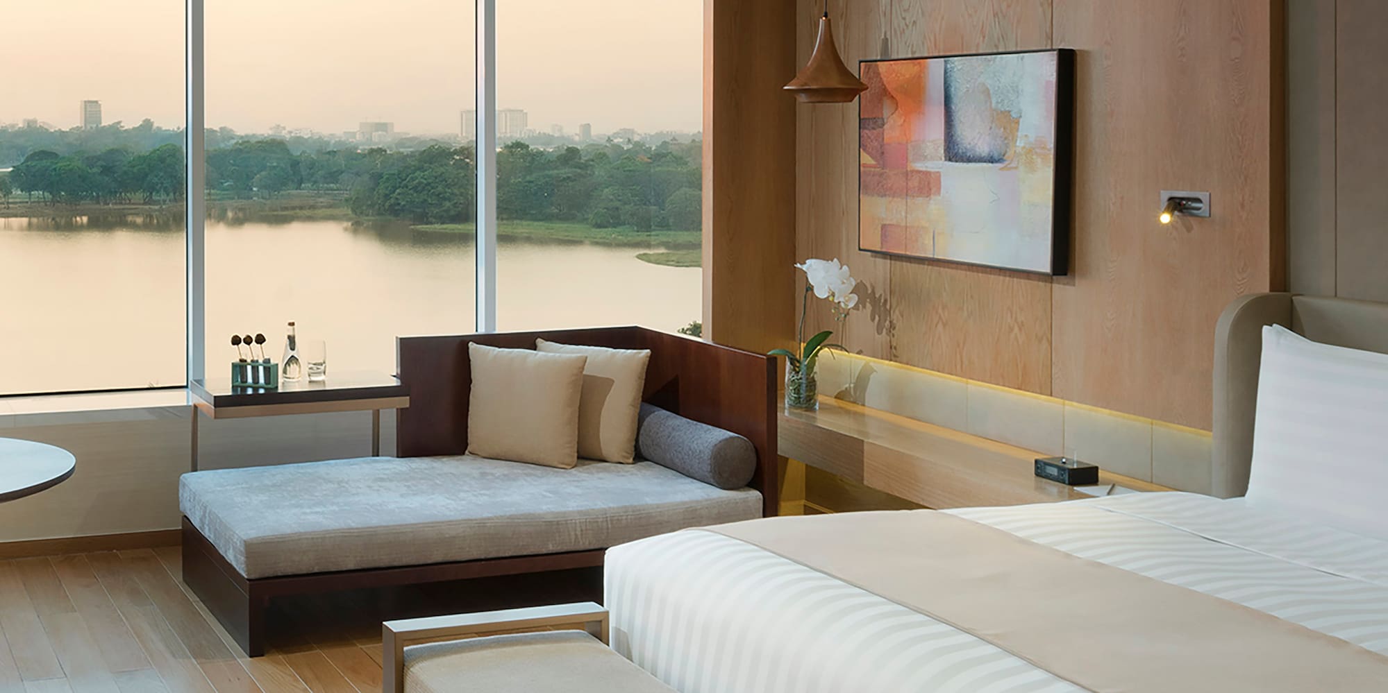 a room with a bed and couches