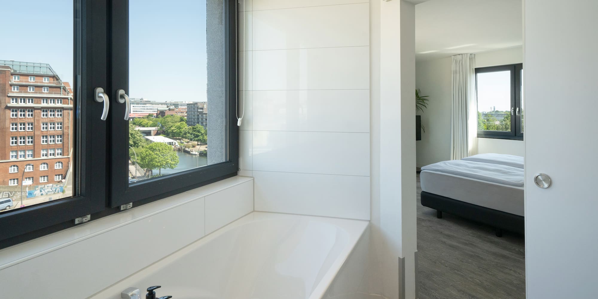 a bathroom with a window and tub