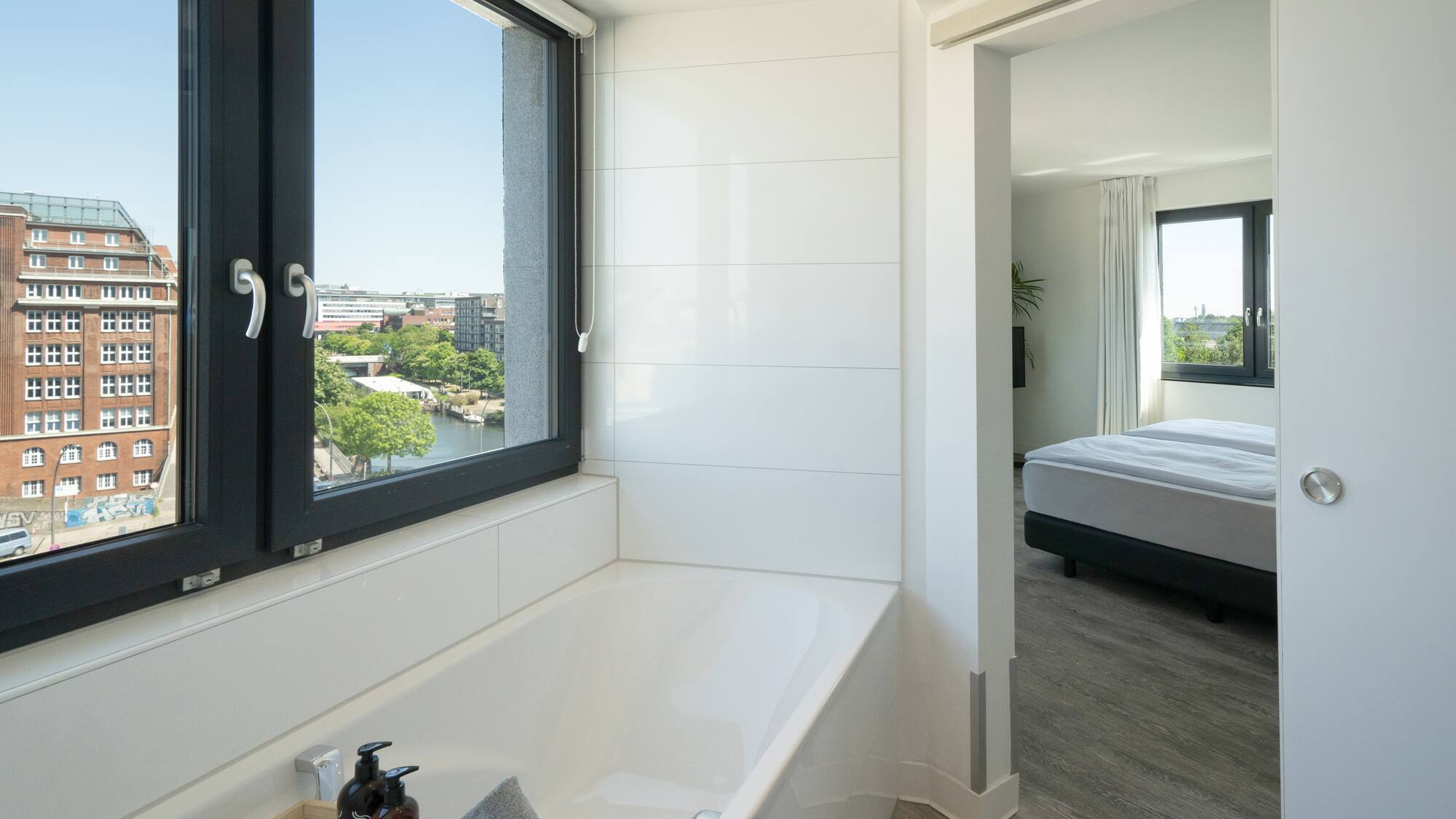 a bathroom with a window and tub