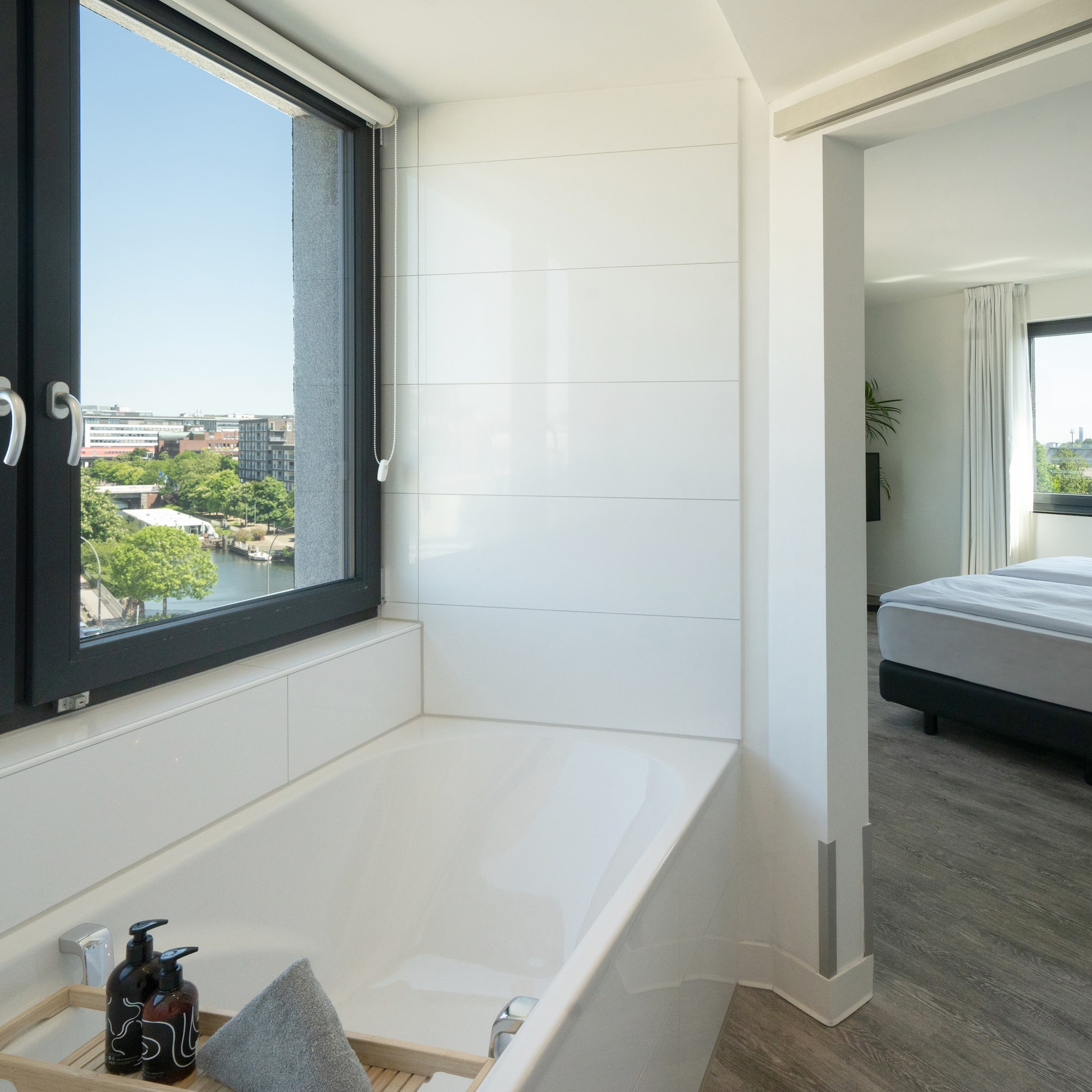a bathroom with a window and tub