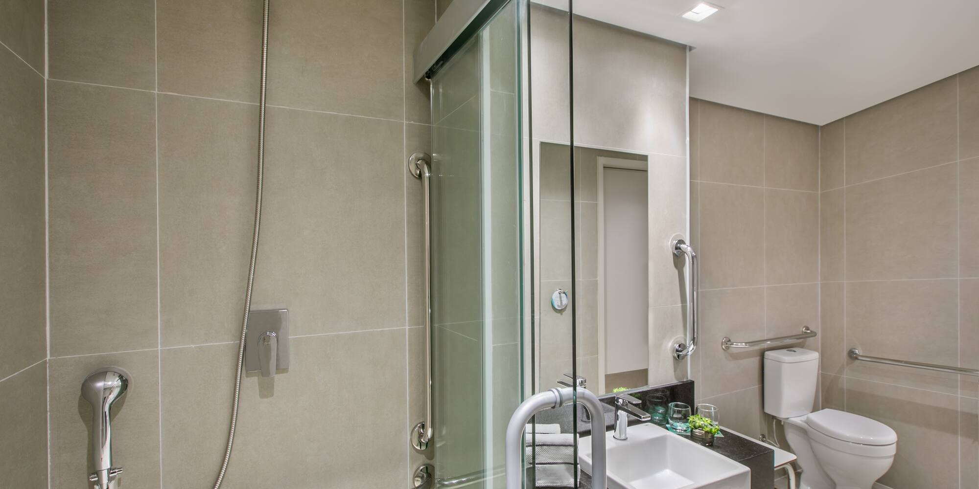 a bathroom with a shower and sink