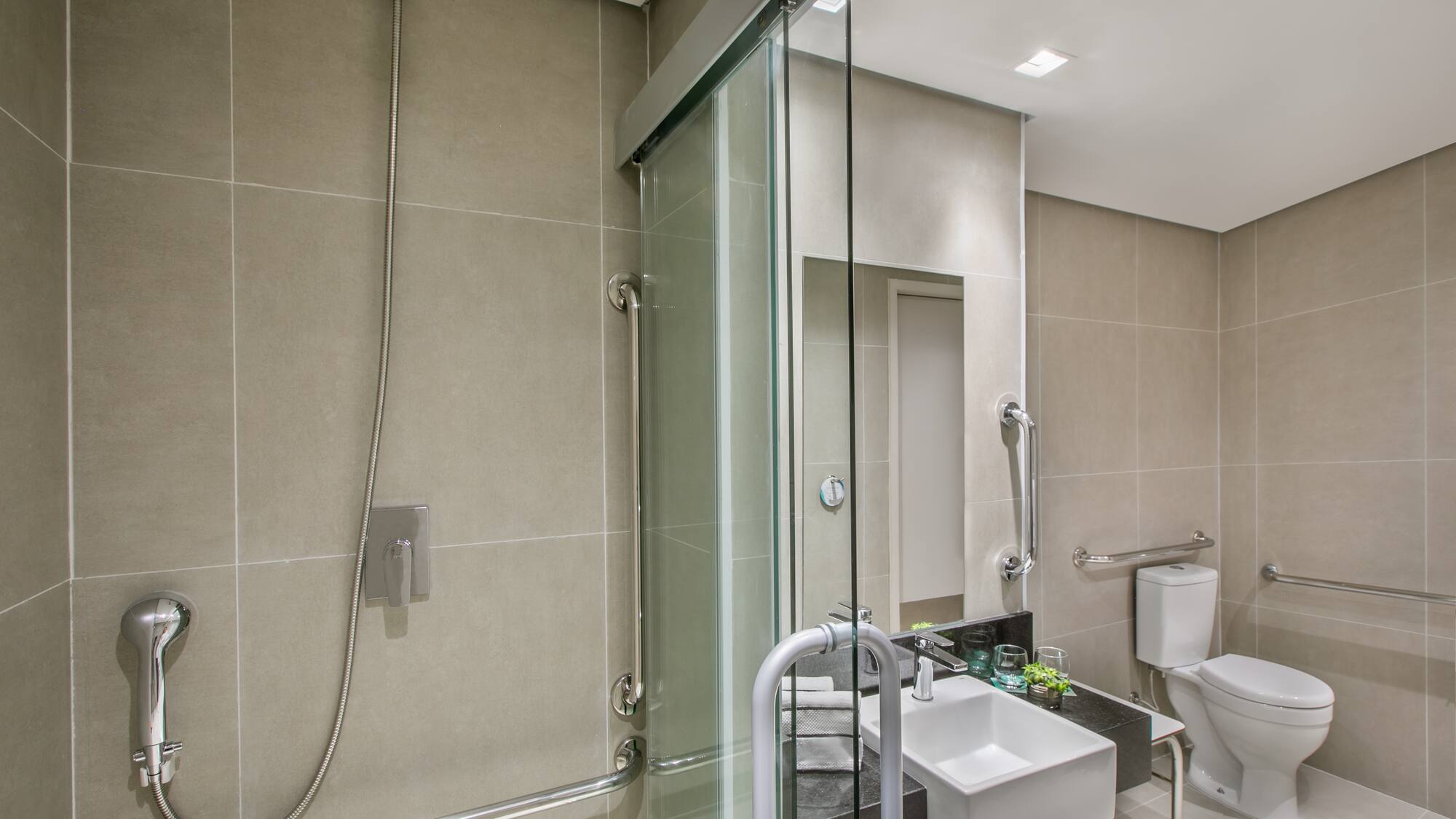 a bathroom with a shower and sink