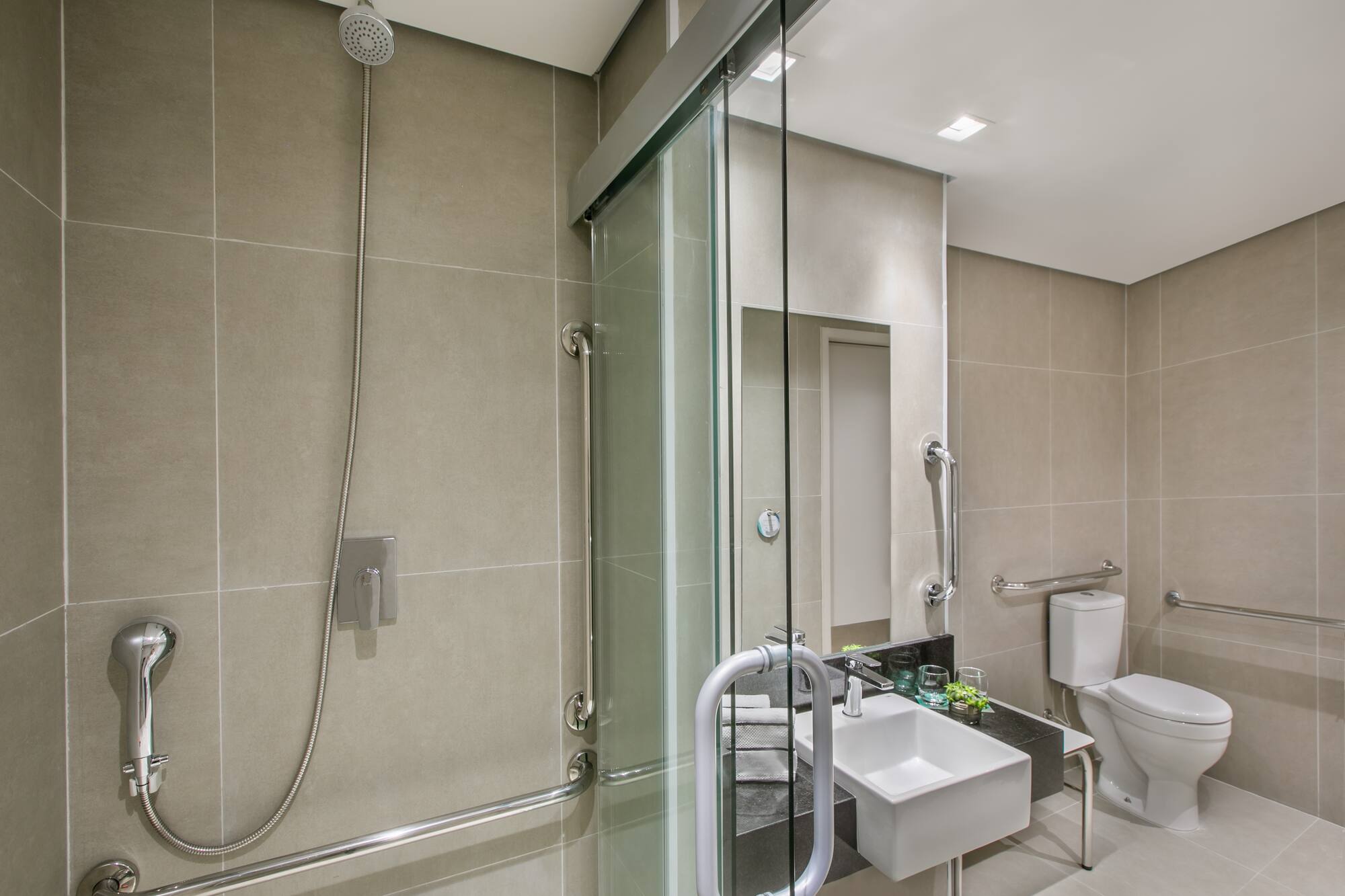 a bathroom with a shower and sink