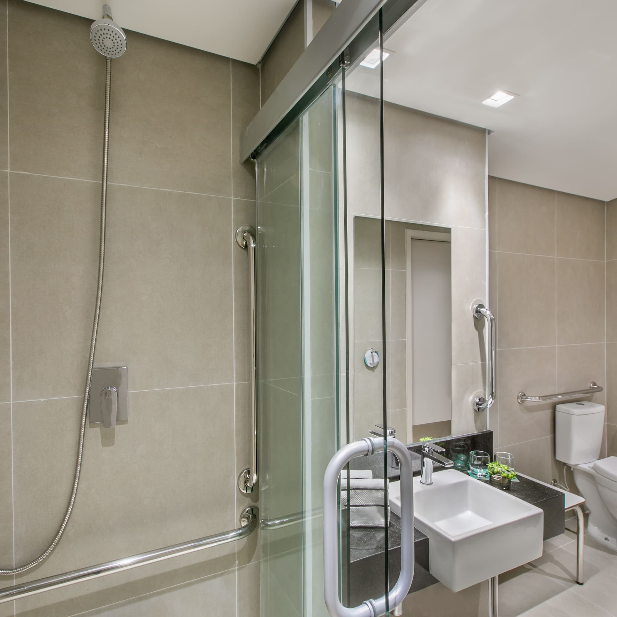 a bathroom with a shower and sink