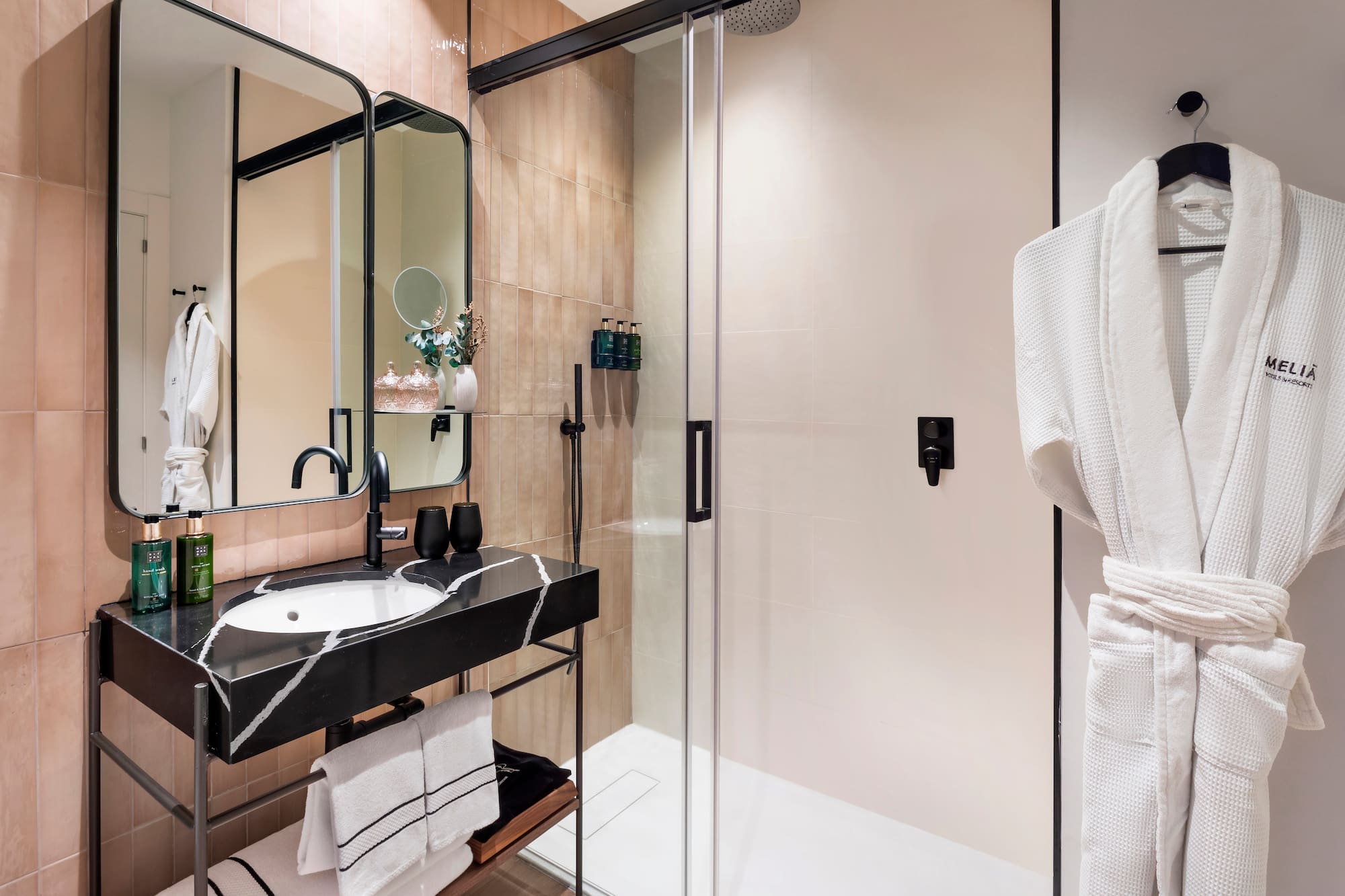 a bathroom with a shower and sink