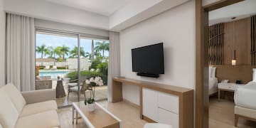 a living room with a television and a pool