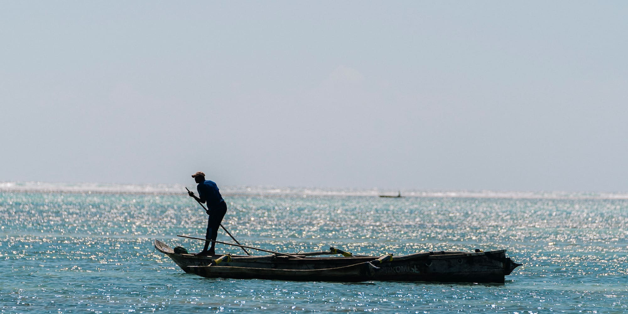 a person on a boat in the ocean