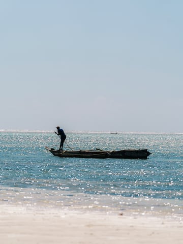 a person on a boat in the ocean