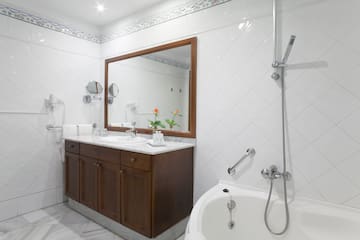 a bathroom with a bathtub and sink