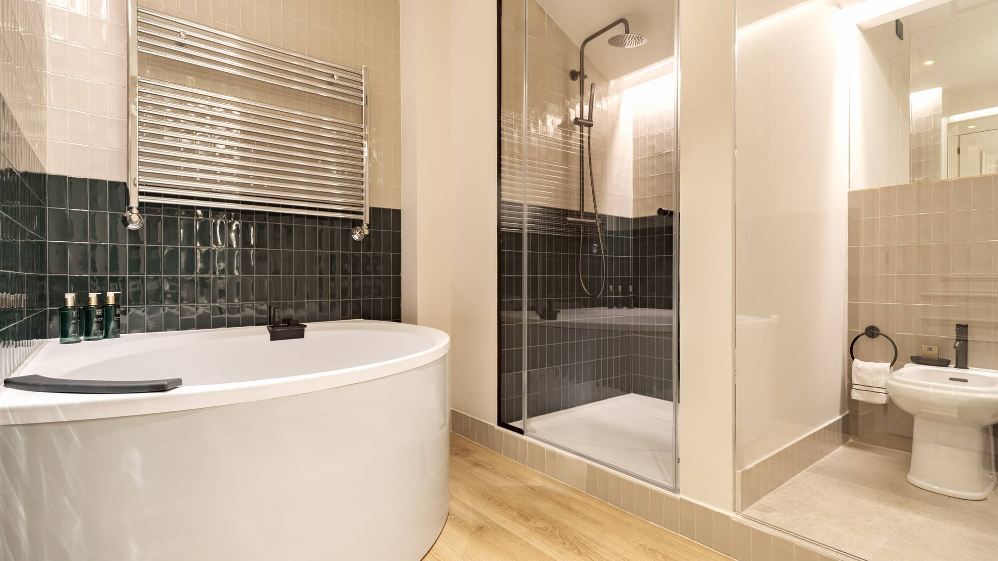 a bathroom with a tub shower and a shower