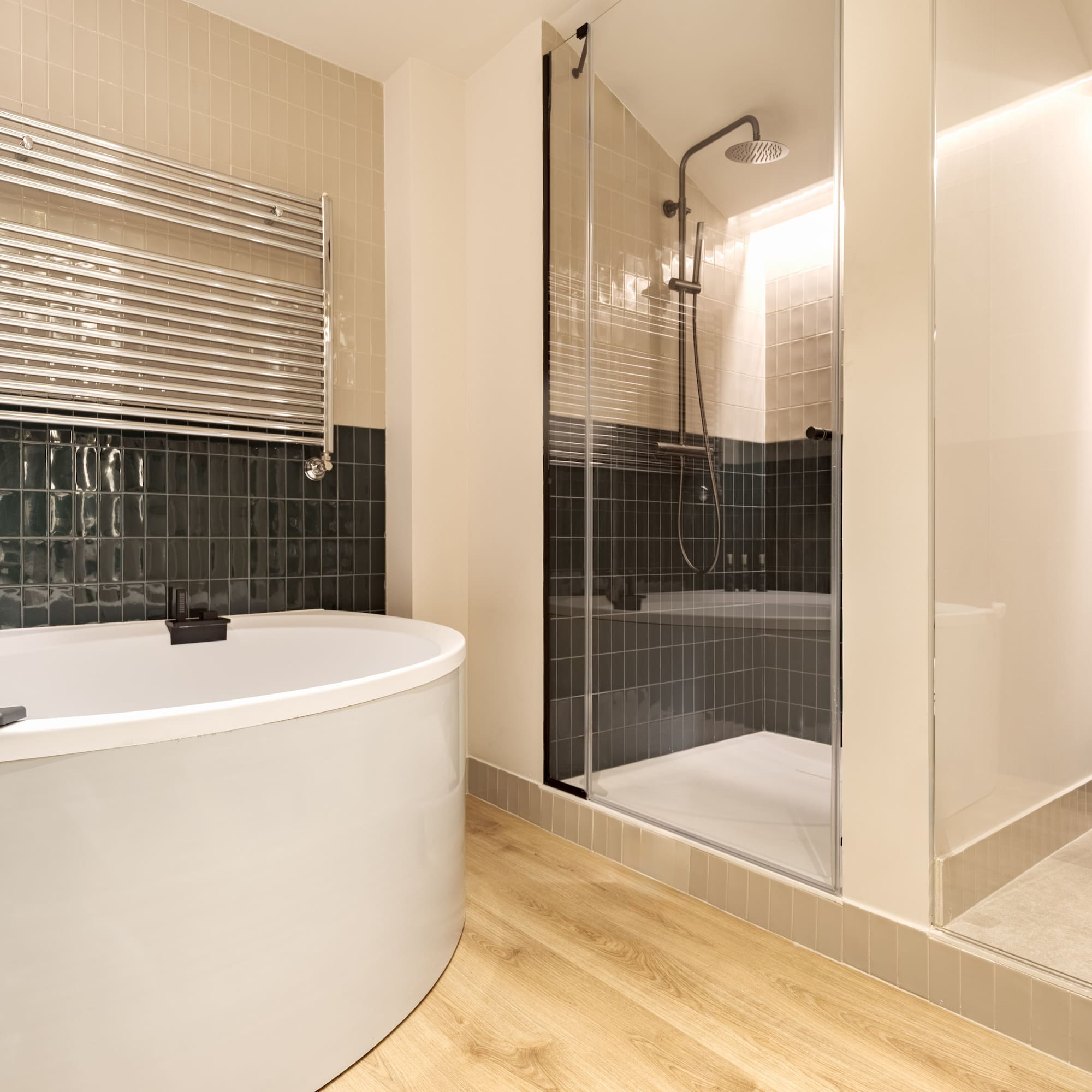 a bathroom with a tub shower and a shower