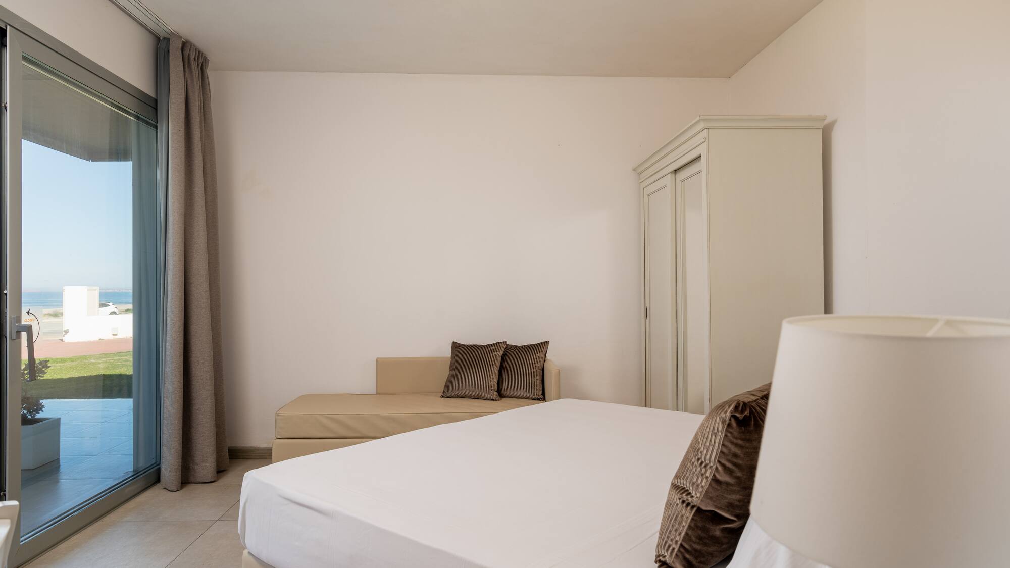 a bedroom with a bed and a couch