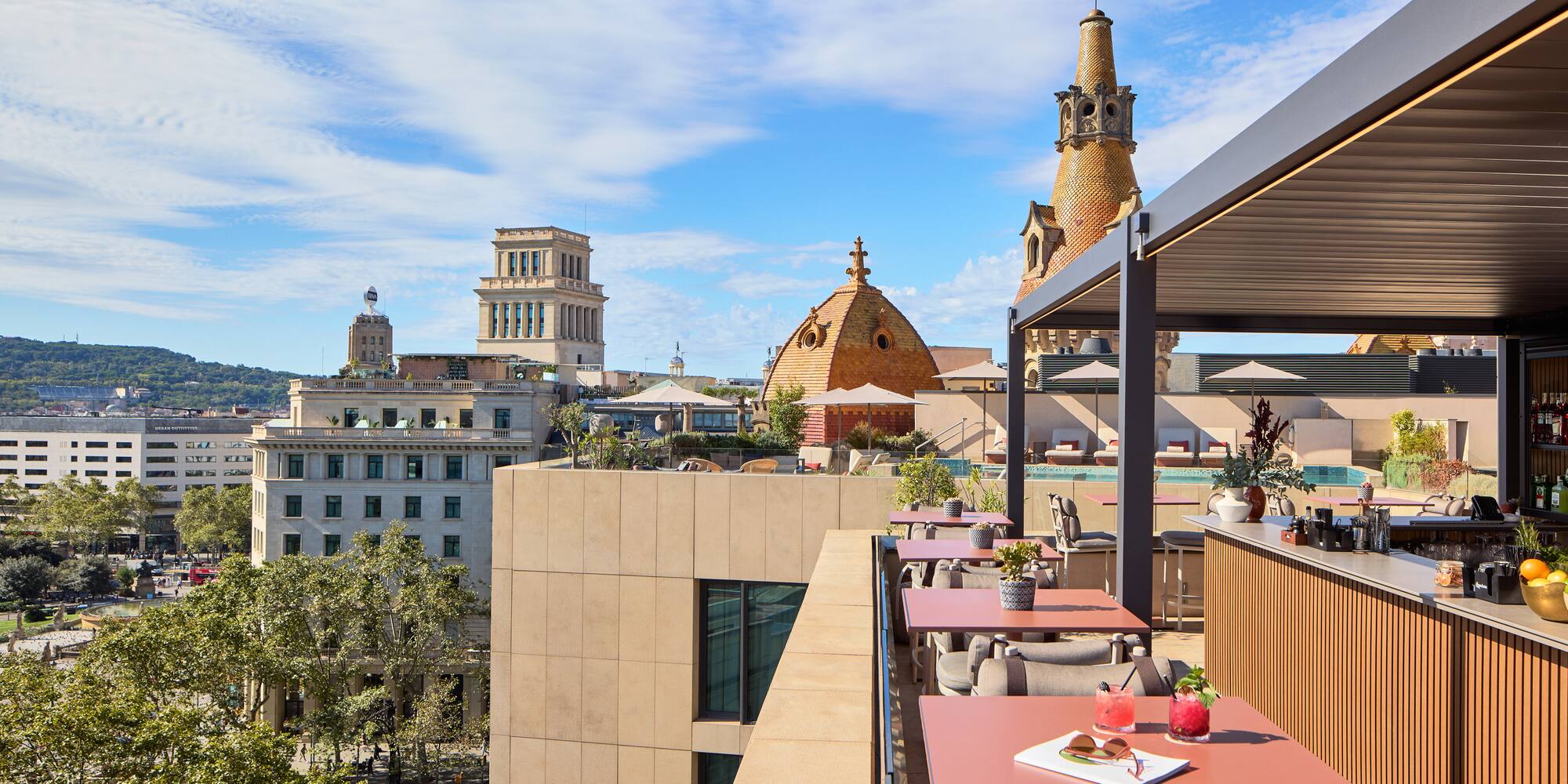 a rooftop restaurant with tables and chairs