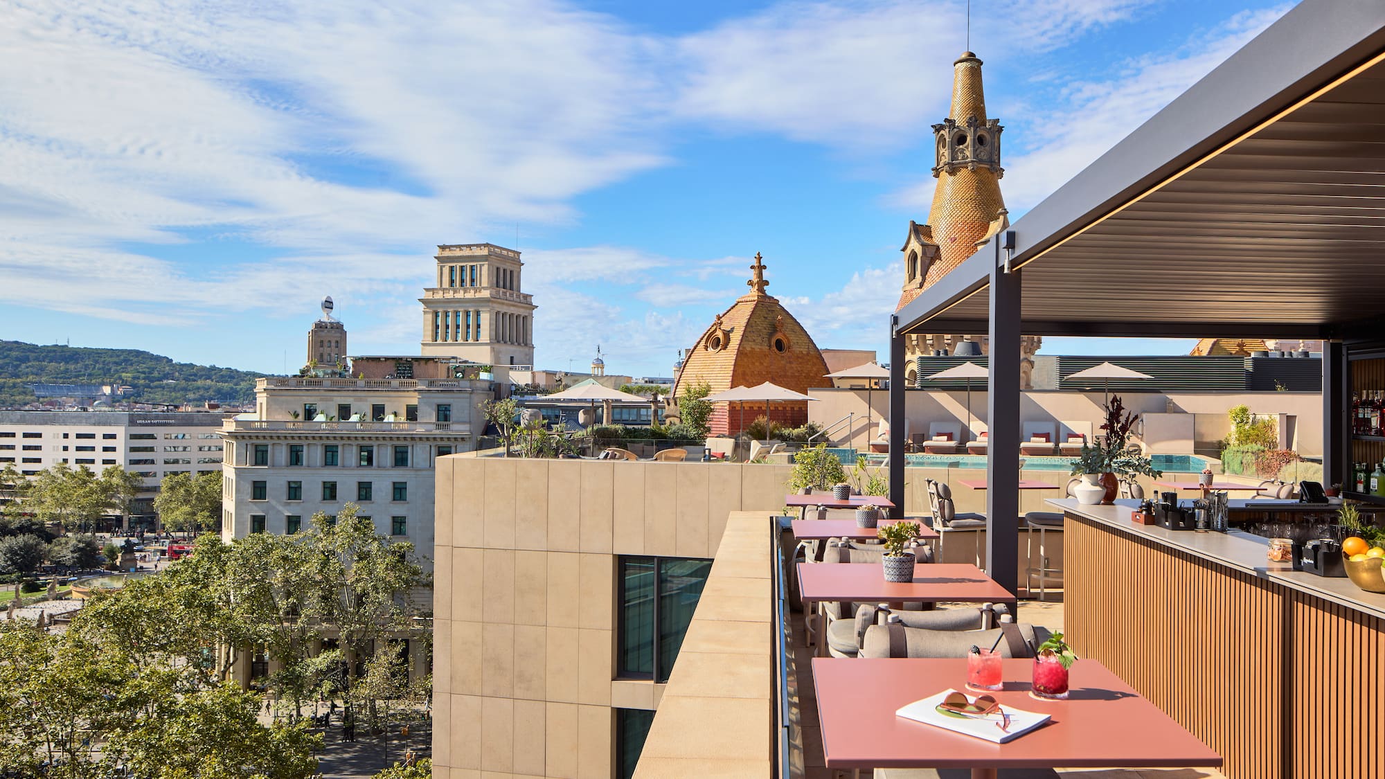 a rooftop restaurant with tables and chairs
