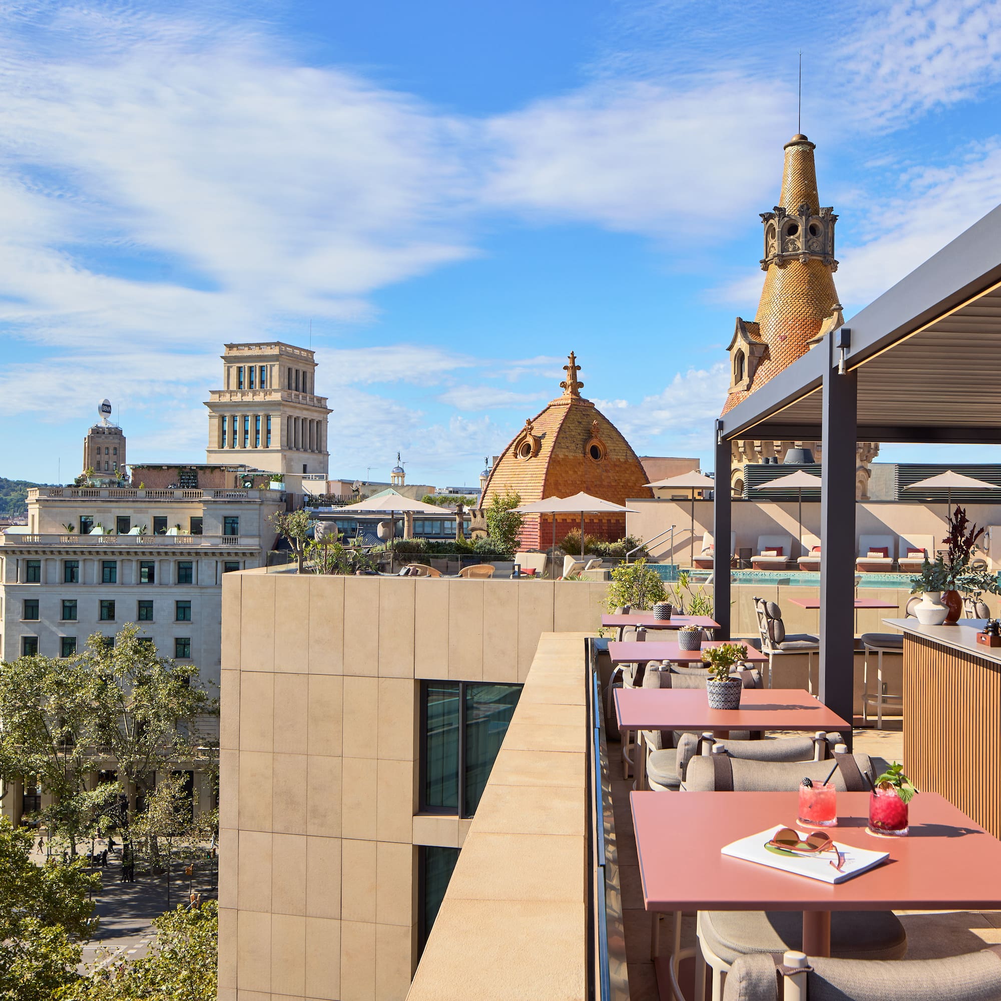 a rooftop restaurant with tables and chairs