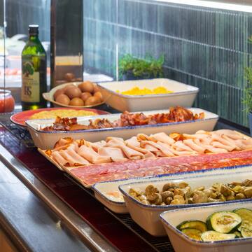 a trays of food on a counter