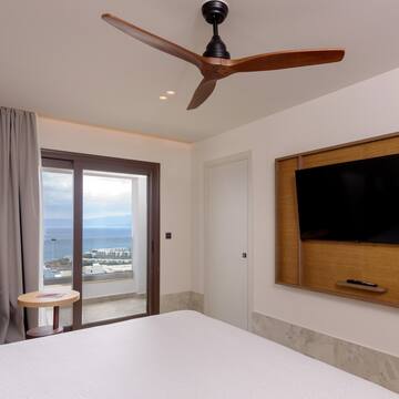 a room with a television and a window