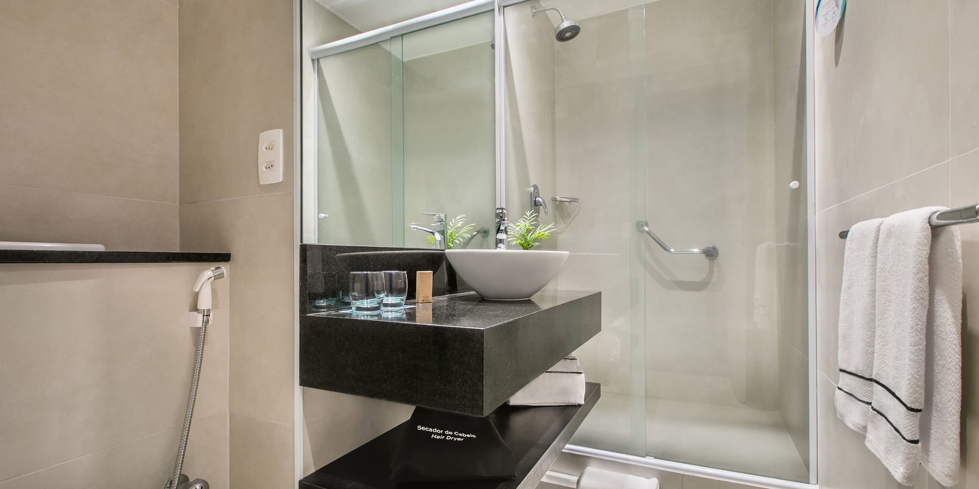 a bathroom with a glass shower door