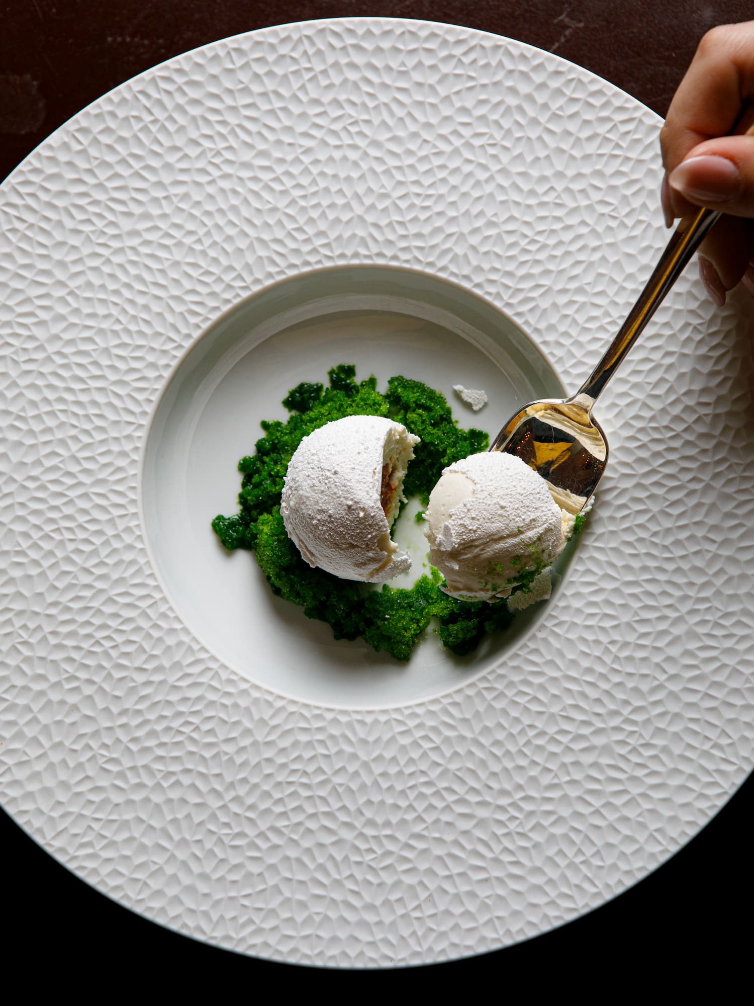 a spoon in a bowl of food