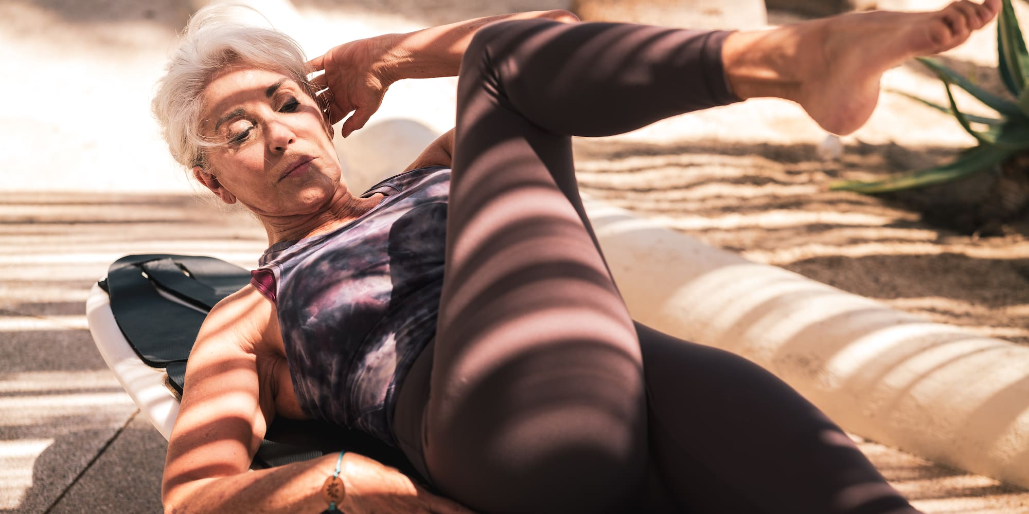 a woman lying on a bench