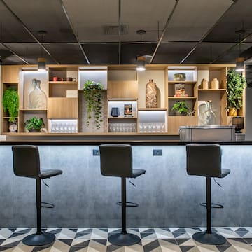 a bar with stools and shelves