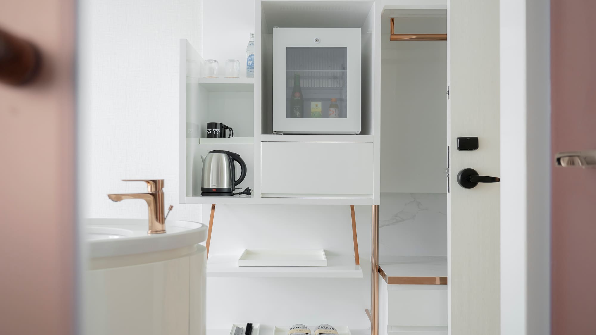 a white shelf with a microwave and a sink