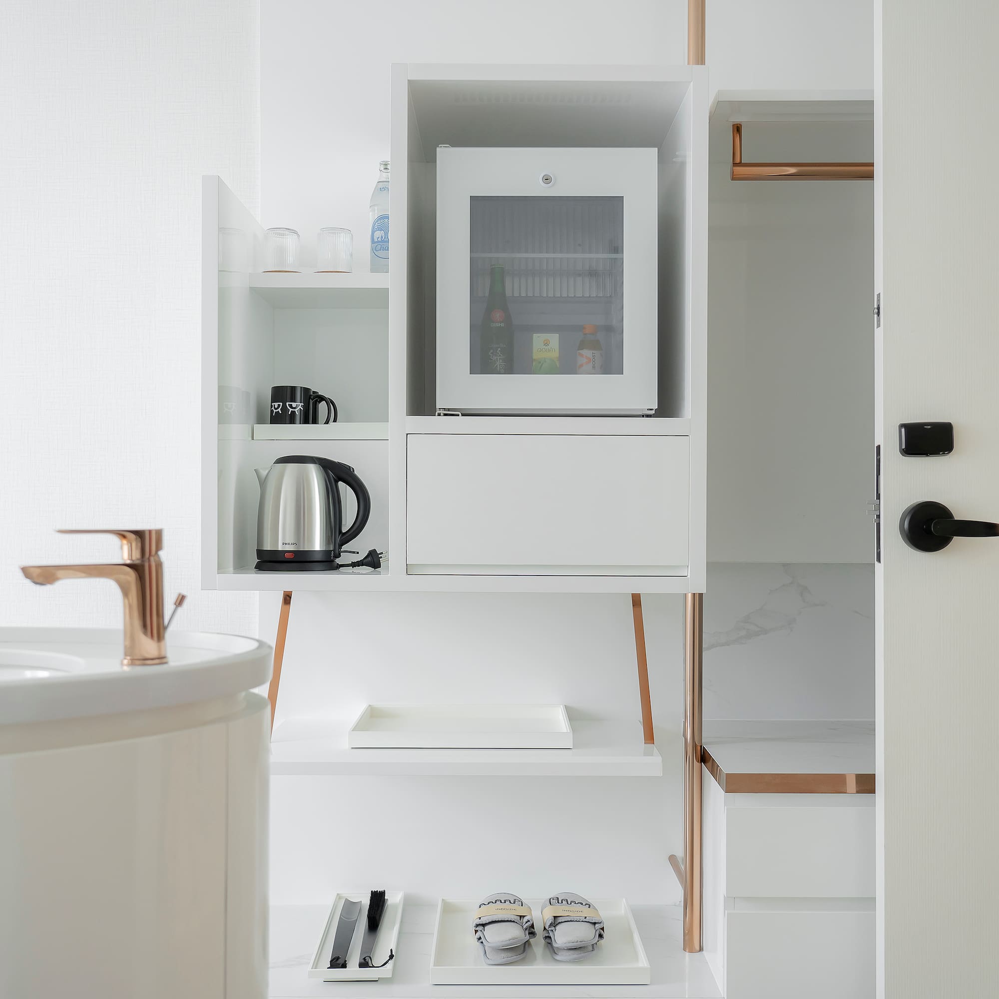 a white shelf with a microwave and a sink