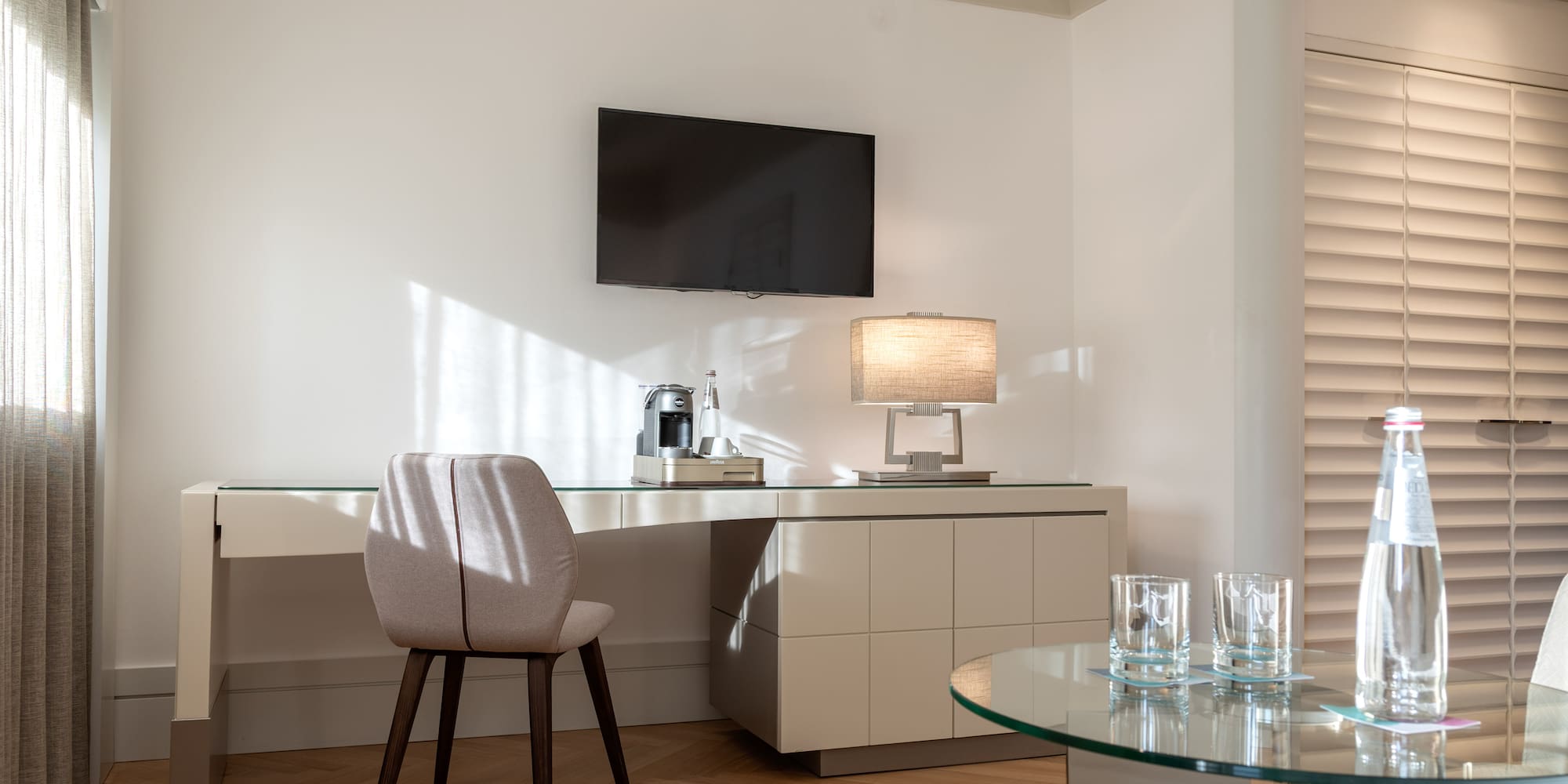 a room with a table and a tv