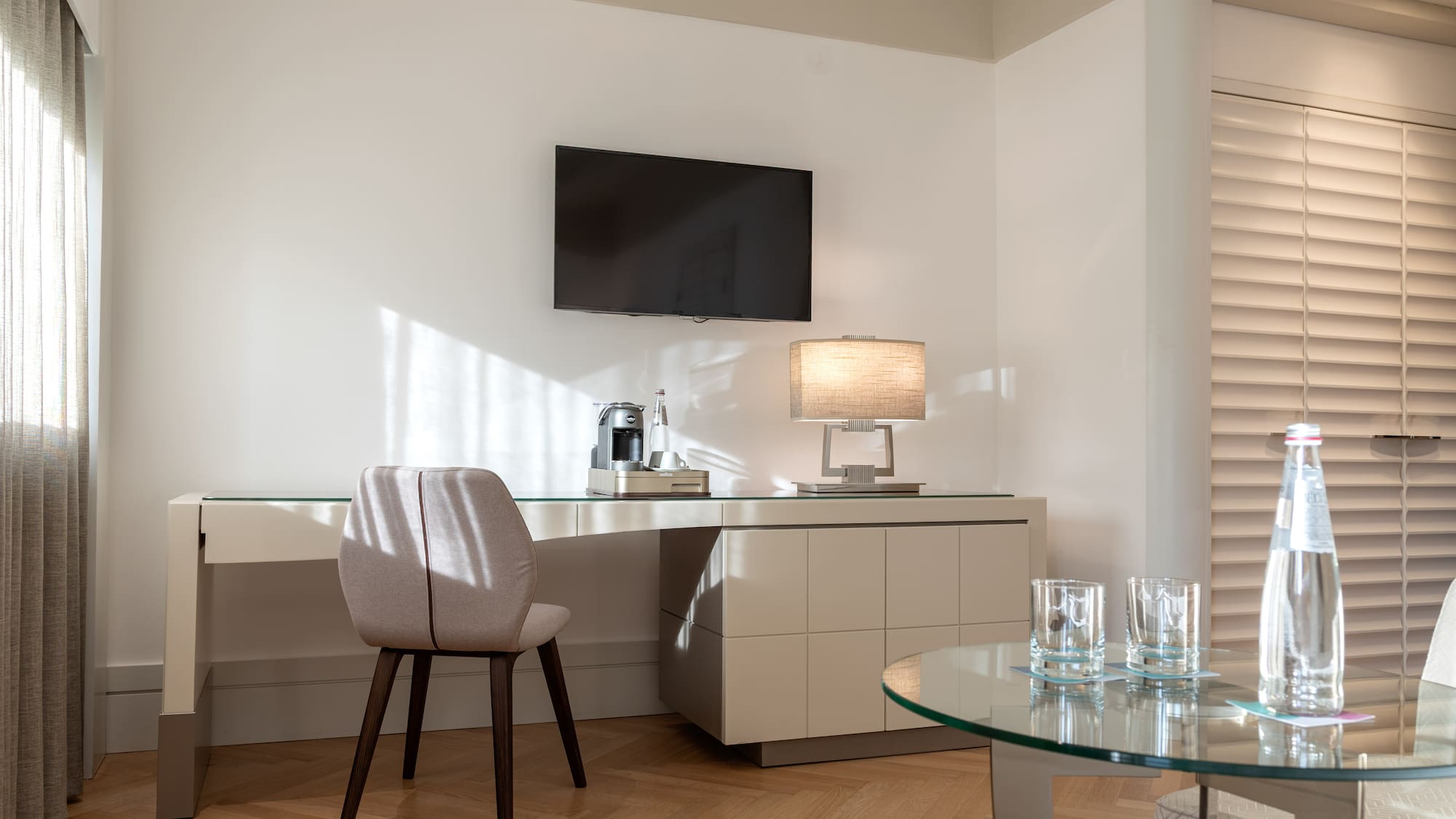 a room with a table and a tv