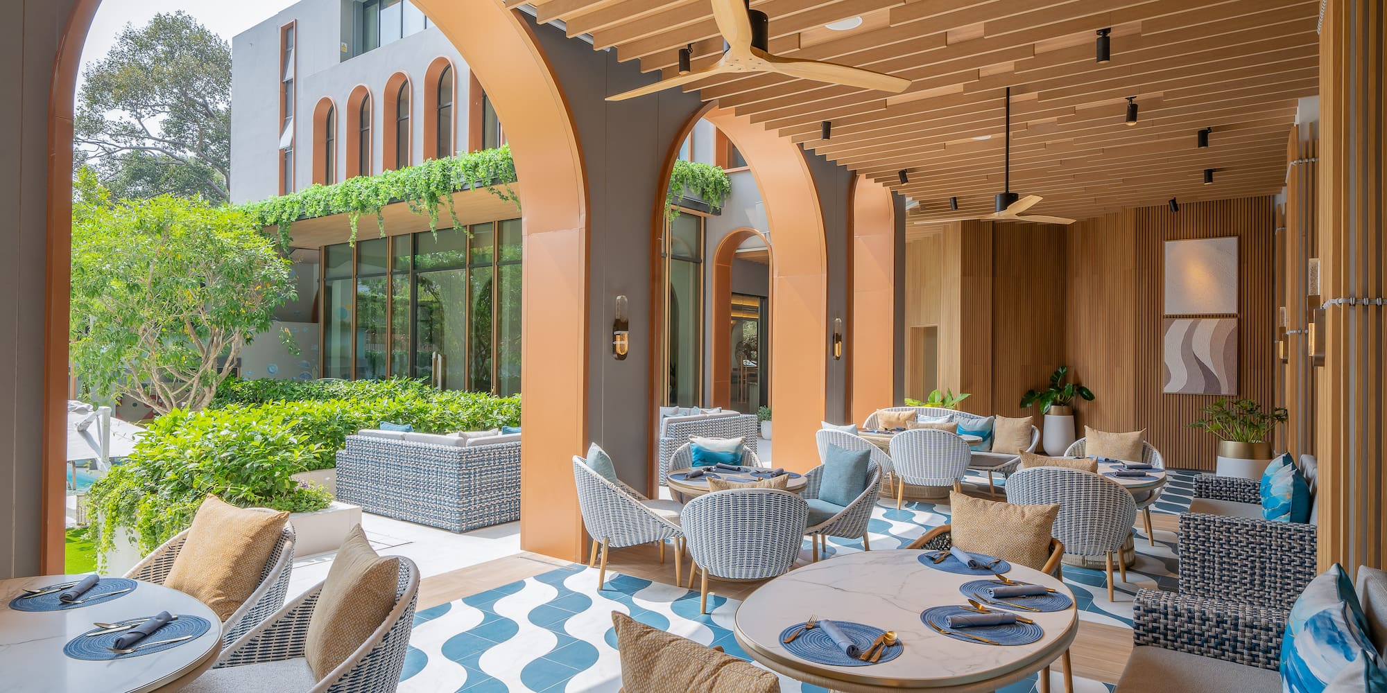 a patio with tables and chairs