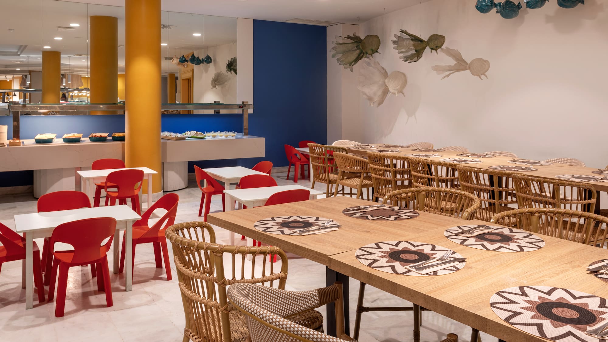 Hotel buffet restaurant with modern decor and family-friendly seating.