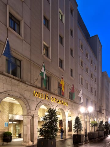 a building with flags on the front