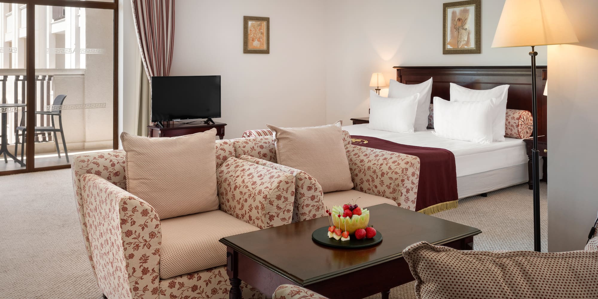 a room with a bed and couches