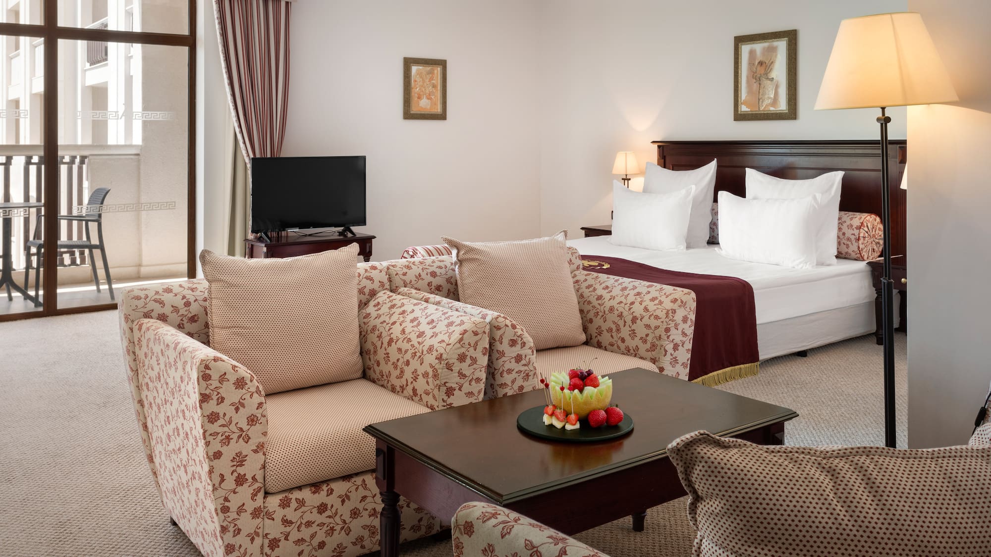 a room with a bed and couches