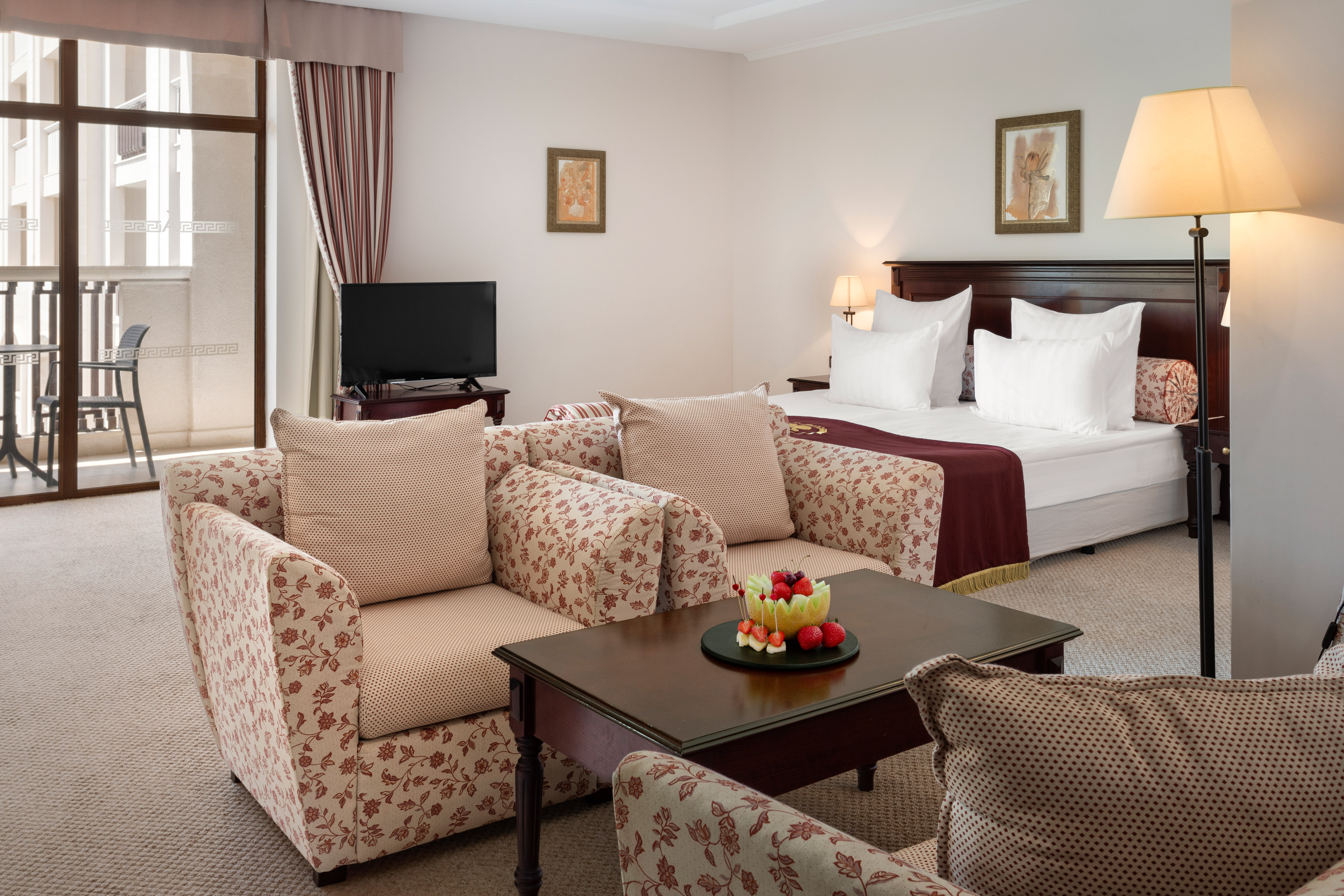 a room with a bed and couches